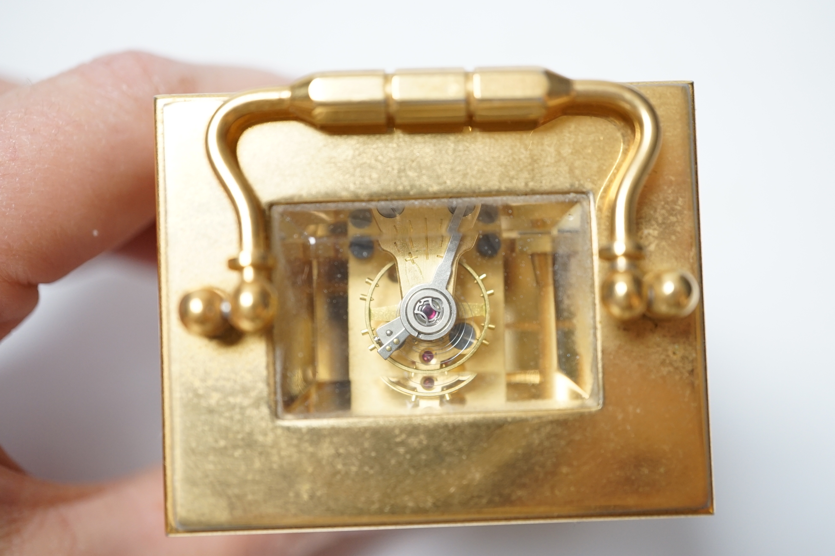 An Angelus miniature brass cased carriage clock with key, 9cm